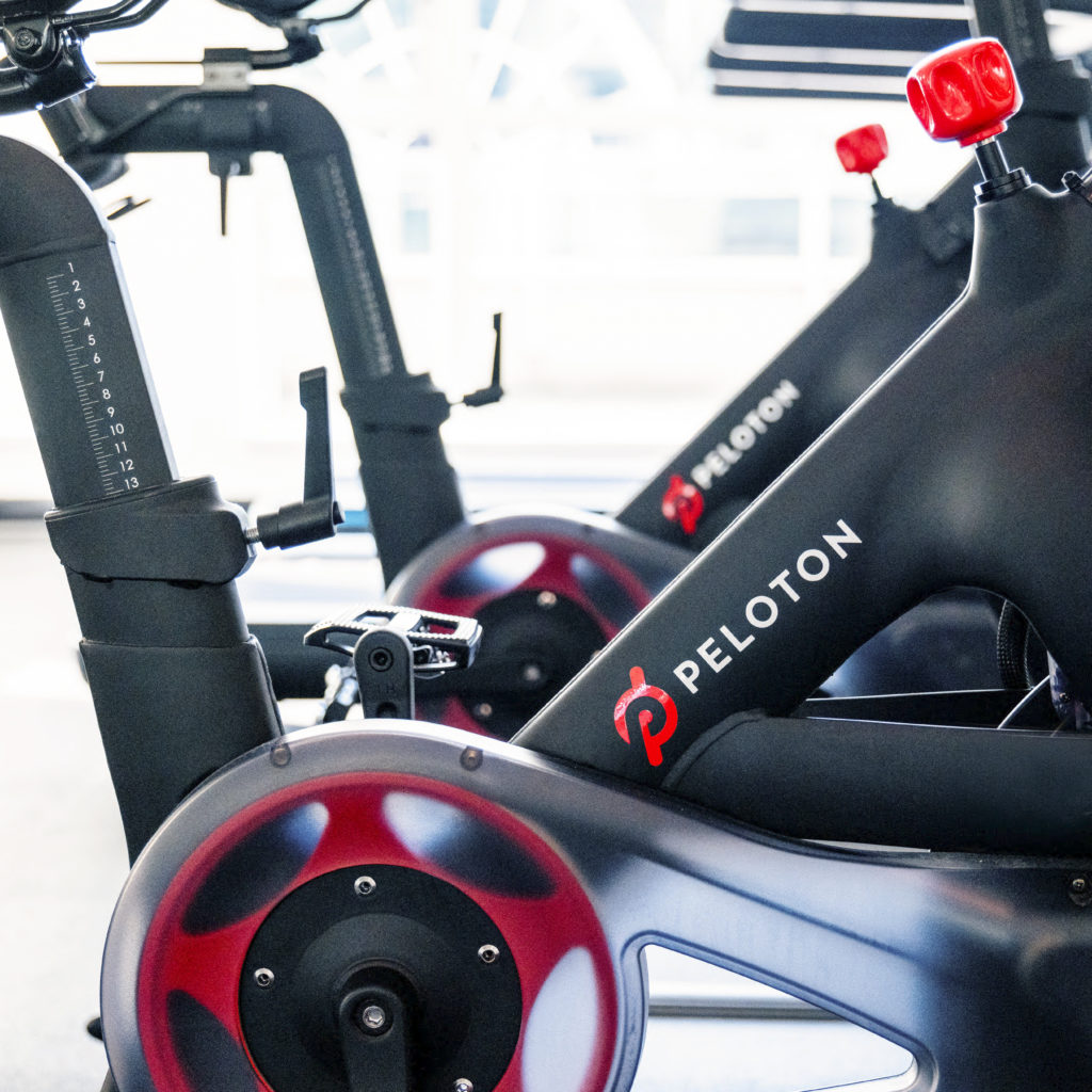 Fitness center with Peloton bikes at Carmana Hotel & Suites.