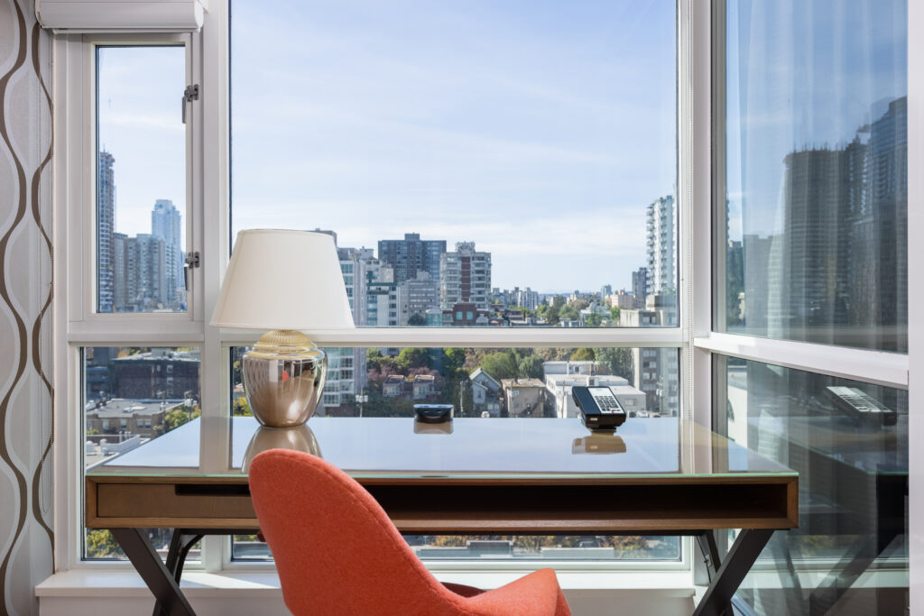 Desk and chair at Carmana Hotel & Suites overlooking downtown Vancouver.